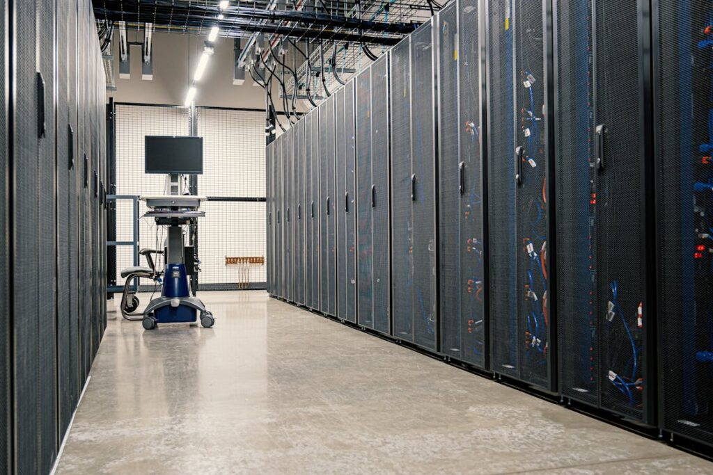 A modern data center corridor lined with server racks powering cloud database infrastructure